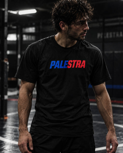 Athlete wearing a black PALESTRA T-shirt